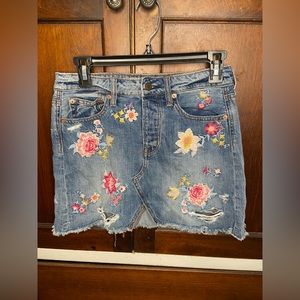 American Eagle Outfitters denim skirt with flower embroidery, size two.